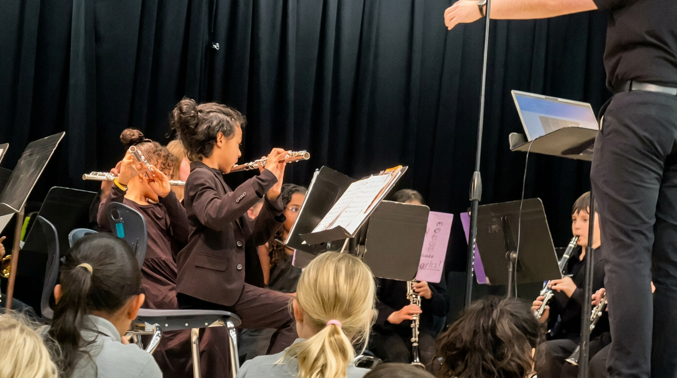 Lincoln performing flute with his school band
